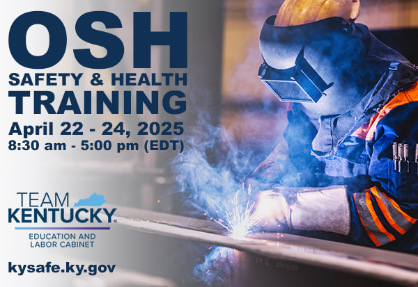 A welder in blue coveralls welds a large piece of metal as white sparks fly.