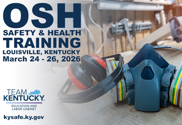 A pair of safety earmuffs and a half-face respirator are placed on a workbench.