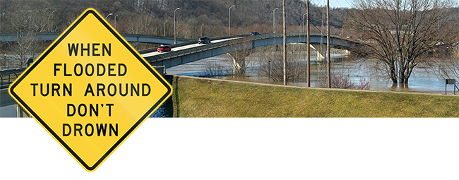 Kentucky River with high floodwaters and "Turn Around, Don't Drown" sign.